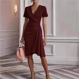 Elegant burgundy V-neck short sleeve dress featuring ruched waist and stylish draped detail.