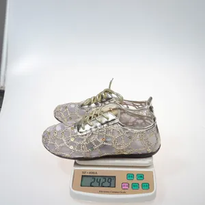 Detailed view of lightweight women's lace mesh flats weighing 242.9g on a scale