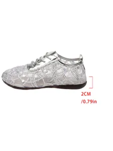 Silver lace mesh flat shoe side view detailing the 2cm low heel height measurement