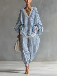 Elegant blue and white striped two-piece lounge set featuring delicate lace trim details