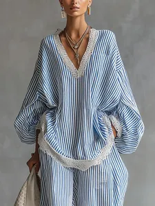 Detail of blue and white striped loose two-piece set with white lace trim for women