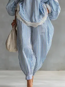 Detailed view of blue and white striped two-piece set with lace trim and casual loose fit