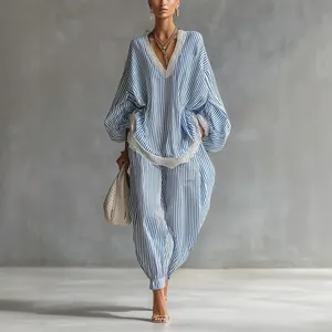 Elegant blue and white striped two-piece lounge set with delicate lace trim details