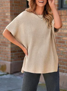 Loose-fitting ribbed knit T-shirt with round neck and drop shoulders on model