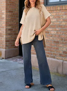 Casual loose-fit beige knit top with drop shoulder short sleeves and side slits.