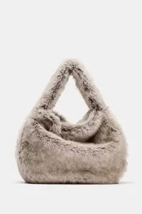 Soft faux fur hobo handbag with fuzzy texture for autumn and winter outfits.