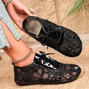 Elegant black lace mesh flats for women with sequin details and lace-up closure. High quality.