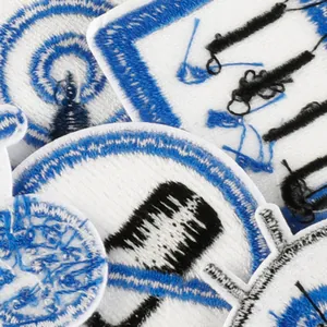 Set of blue and white embroidered patches with eye and geometric designs for clothes