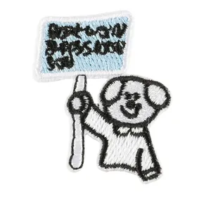 Korean style cartoon dog embroidered iron-on patch holding a blue sign for clothes
