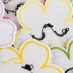 Macro detail of colorful flower embroidery patches for clothing and DIY craft decor