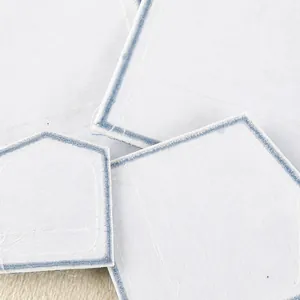 Light blue embroidered mock pocket patches for iron-on clothing decoration and repair