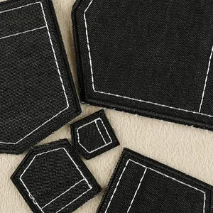 Set of black denim style fake pocket iron-on embroidery patches with white stitching
