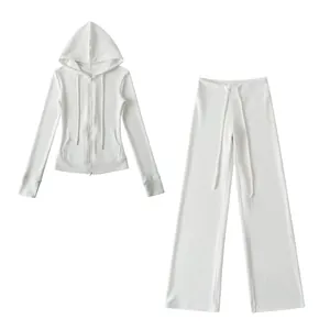 Detailed view of white warm yoga set featuring slim hoodie and wide-leg pants