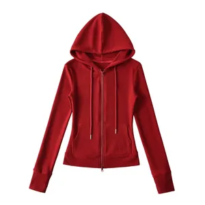 Detailed view of a vibrant red zip-up hooded sweatshirt featuring a front pocket design