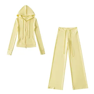 Two-piece thermal yoga set in light yellow featuring a zip-up hoodie and wide-leg trousers