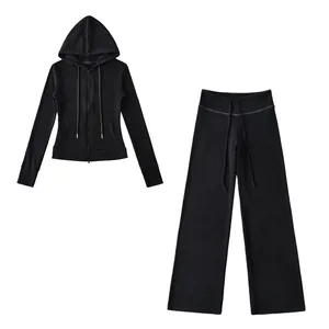 Detailed product view of black slim-fit zip-up hoodie and wide-leg yoga pants set