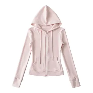 Detail shot of pink zip-up hoodie with hood, drawstrings, and front kangaroo pockets.