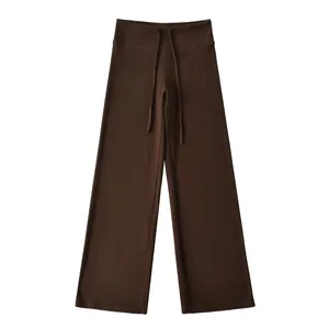 Detailed view of brown high-waisted wide-leg straight sweatpants featuring adjustable drawstring