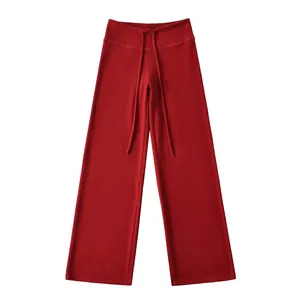 Detail view of red Dralon thermal wide-leg yoga pants with drawstring waist design.