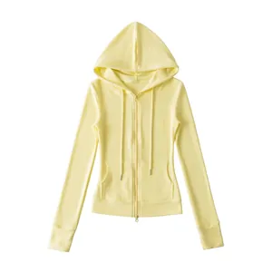 Pale yellow slim-fit zip-up hoodie with drawstring hood and front pockets.
