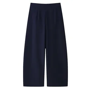 Flat lay view of navy blue women's wide-leg pants with a relaxed casual fit and drape