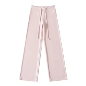 Detailed close-up view of light pink high-waisted wide-leg yoga trousers with drawstring waist