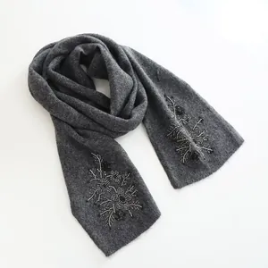 Elegant gray wool knit scarf featuring intricate floral beaded embroidery on both ends