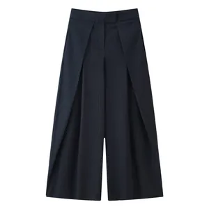 Detail of navy blue pinstriped wide-leg trousers with elegant pleats for women