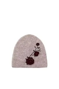Detailed view of gray knitted beanie featuring elegant dark red floral embroidery.
