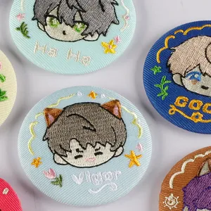 Collection of cute anime embroidered round badges with various character designs and text