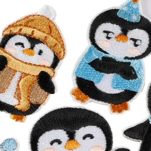 Selection of cute cartoon penguin embroidered self-adhesive patches for clothing decor