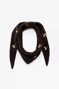 Detailed close-up view of dark brown knitted head kerchief featuring floral embroidery