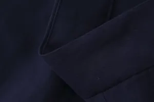 Detailed macro shot of the high-quality navy blue twill fabric texture for wide-leg trousers