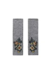 Detailed view of grey knitted arm warmers with intricate floral embroidery beads