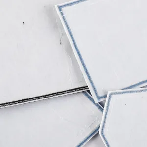 Collection of white DIY fabric embroidery patches with blue denim pocket stitch design