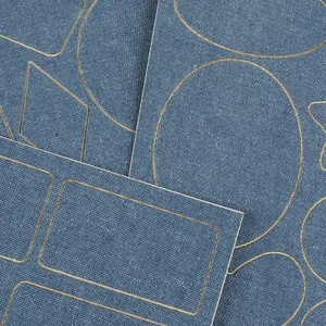 Assorted blue self-adhesive denim patches for clothing repair in various pre-cut shapes.