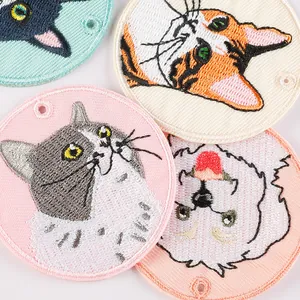 Set of four cute embroidered cat pendants for bags and keychains