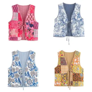 Reversible quilted floral patchwork vest with striped lining shown in four color options