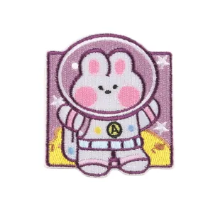 Cute pink astronaut bunny embroidered patch with purple square border and star details