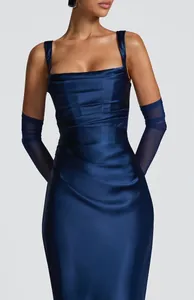 Detail view of navy blue satin evening dress with ruched waist and sheer gloves