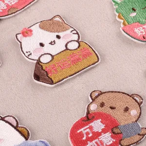 Set of cute cartoon animal embroidered patches featuring cat and bear designs