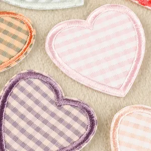 Beautiful heart-shaped checkered embroidered patches with fine stitching texture