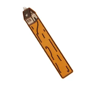 Creative handmade embroidered bookmark with cottage design on textured fabric background