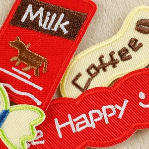 Colorful embroidered patches featuring Milk, Coffee, and Happy designs for DIY crafts.