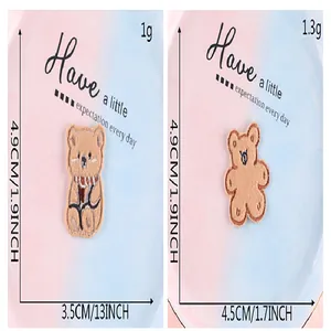 Comparison of two cute plush bear embroidered self-adhesive patches with dimensions