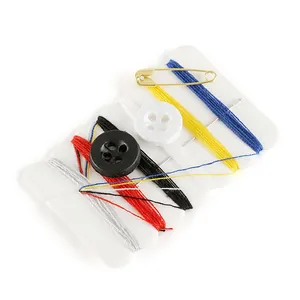Compact travel sewing kit featuring colorful threads, buttons and pins on white background