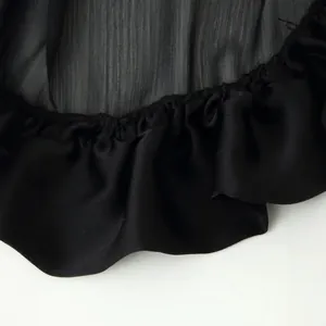 Black tiered ruffle long skirt featuring elegant multi-layer chiffon ruffles for summer