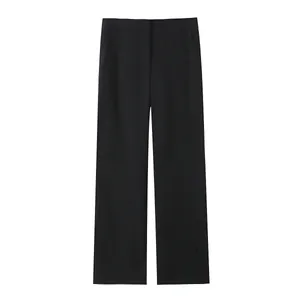 Detailed view of black high-waisted wide-leg trousers with clean minimalist design