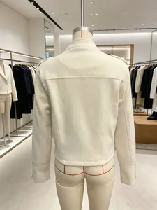 Detailed back view of a vintage cream court style woolen short jacket on a mannequin