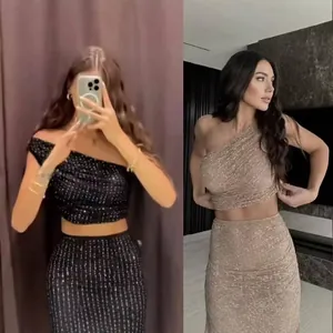 Women's glamorous two-piece set with one-shoulder sequin top and matching bodycon skirt